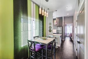 a dining room with a table and some green walls at Aspenwood Manor in Provo