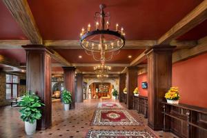 a large lobby with a chandelier and pillars at Mercure Danang French Village Bana Hills in Da Nang +164 photos