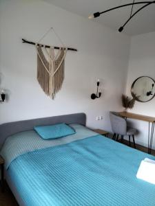 Posteľ alebo postele v izbe v ubytovaní Apartament Słoneczny 2