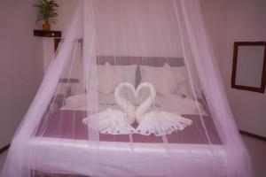 Letto o letti in una camera di Flash Rock Villa