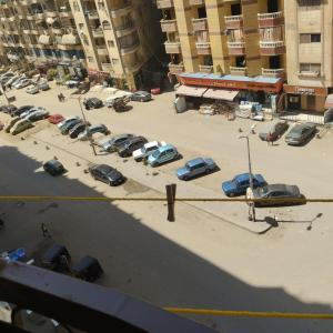 a group of cars parked in a parking lot at شقة مفروشة سوبر لوكس للايجار in Cairo