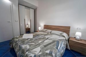 a bedroom with a large bed in a room at Antico Palazzo del Corso in Mirto Crosia