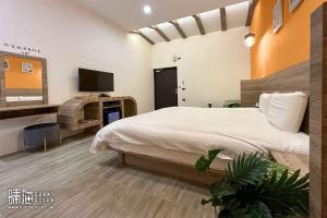 TV a/nebo společenská místnost v ubytování Sunny Ocean B&B + 37 fotografií
