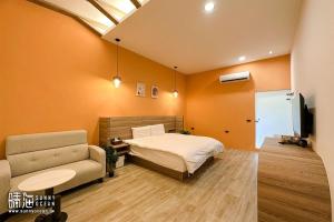 TV a/nebo společenská místnost v ubytování Sunny Ocean B&B
