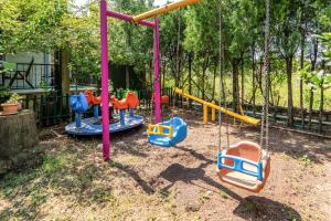a playground with a swing set in a yard at Vacation Flat w Garden Patio BBQ in Mugla in Mugla