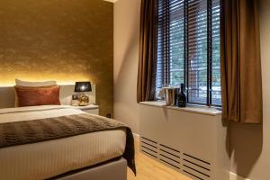 Postel nebo postele na pokoji v ubytování Hotel de Boskar Houthalen