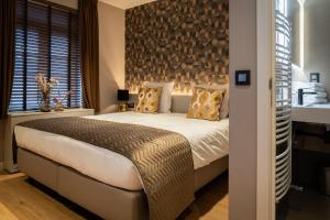 Postel nebo postele na pokoji v ubytování Hotel de Boskar Houthalen
