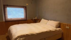 Postel nebo postele na pokoji v ubytování Wanli Spa & Resort