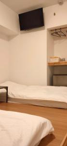 Postel nebo postele na pokoji v ubytování Hostel Belle Via Tokyo