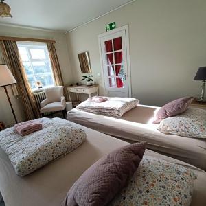 Postel nebo postele na pokoji v ubytování Arsalir Guesthouse Vik B&B + 37 fotografií