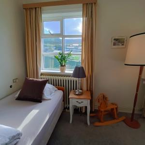 Voodi või voodid majutusasutuse Arsalir Guesthouse Vik B&B toas