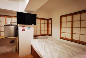 Postel nebo postele na pokoji v ubytování Hostel Belle Via Tokyo
