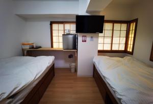 Postel nebo postele na pokoji v ubytování Hostel Belle Via Tokyo