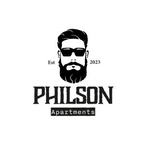 un logotipo para un hombre con barba en PHILSON Apartments en Saalbach Hinterglemm