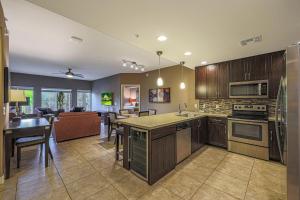 an open kitchen and living room with a dining room at Villa Toscana condo in Phoenix