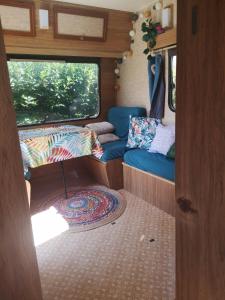 an interior view of an rv with the door open at Caravane Vintage Esparadenn l'esprit d'antan in Guengat