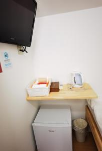 TV a/nebo společenská místnost v ubytování Hostel Belle Via Tokyo
