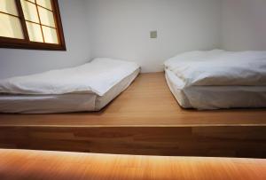 Postel nebo postele na pokoji v ubytování Hostel Belle Via Tokyo
