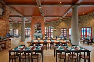 a large dining room with tables and chairs at Mercure Danang French Village Bana Hills in Da Nang