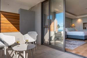 Postel nebo postele na pokoji v ubytování Plett Quarter Hotel - Lion Roars Hotels & Lodges