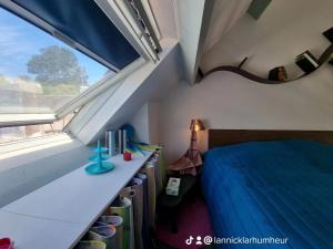 a bedroom with a bed and a window at LOC'MARIA in Sauzon