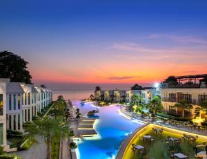 an aerial view of a resort at sunset at Vannee Golden Sands Beachfront Resort in Haad Rin