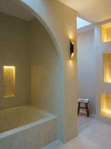 a bathroom with a bath tub in a room at Cortijo Boutique Siete Calas in Rodalquilar