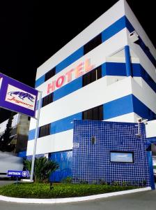 a hotel with a blue and white building at Jaguaré Hotel in Sao Paulo