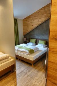 a bedroom with two beds in a room at Camping Bissen in Esch-sur-Sûre