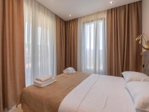 Postel nebo postele na pokoji v ubytování Hotel Diman