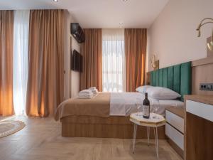 Postel nebo postele na pokoji v ubytování Hotel Diman