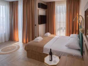 Postel nebo postele na pokoji v ubytování Hotel Diman