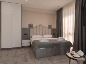 Postel nebo postele na pokoji v ubytování Hotel Diman