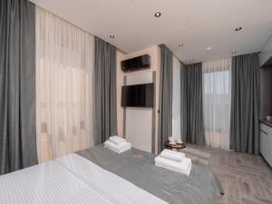 Postel nebo postele na pokoji v ubytování Hotel Diman