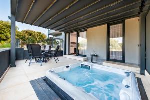 a hot tub on the patio of a house at Luxury Residence Levante in Rovinj