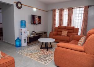 Predel za sedenje v nastanitvi Havan Furnished Apartments- Hyrax Hill