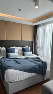 Postel nebo postele na pokoji v ubytování Lovely family apartment at Surin Beach - Aristo 1, unit 203