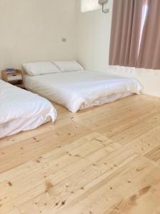 Una cama o camas en una habitación de Starry Sky Hostel