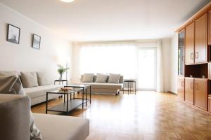 a living room with a couch and a table at Monteurwohnung Saarlouis, Ferienhaus, WLAN, Parkplatz in Saarlouis