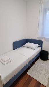 En eller flere senge i et værelse på Maslina House - Family apartment 1 with Pool + 23 billeder