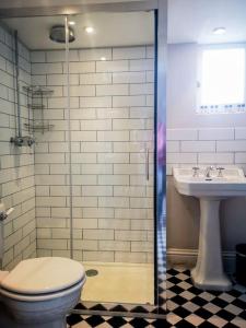 a bathroom with a toilet and a sink at Cliff Cottage with private garden - Broadstairs in Kent