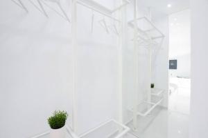a white room with white walls and white shelves at Cozy two-bedroom apartment in Athens in Piraeus