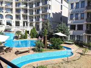 a swimming pool in front of a building at The Cliff in Obzor