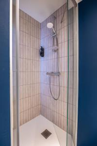 a shower with a glass door in a bathroom at ibis La Rochelle Centre Historique in La Rochelle