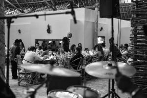 a group of people sitting at tables in a restaurant at NDAME Paje Hotel in Paje +84 photos