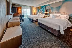Postel nebo postele na pokoji v ubytování Courtyard by Marriott Westbury Long Island