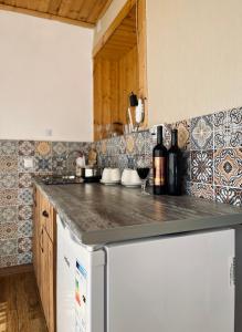 a kitchen with a counter top and a dishwasher at 4 Brothers in Kutaisi