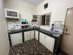 Kuchyň nebo kuchyňský kout v ubytování A to Z Guest House + 9 fotografií