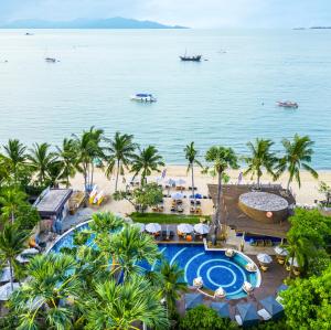 an aerial view of a resort with a pool and a beach at Bandara Spa Resort & Pool Villas, Samui in Bophut