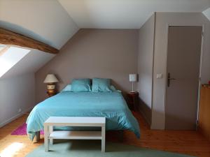 Ένα ή περισσότερα κρεβάτια σε δωμάτιο στο La Chaumière de Mauvrain